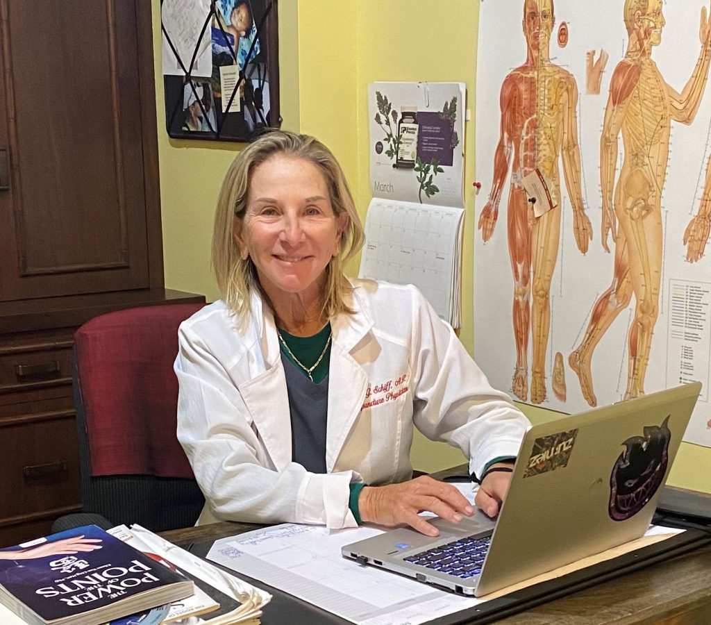 Susan Schiff at her desk in official practice photography